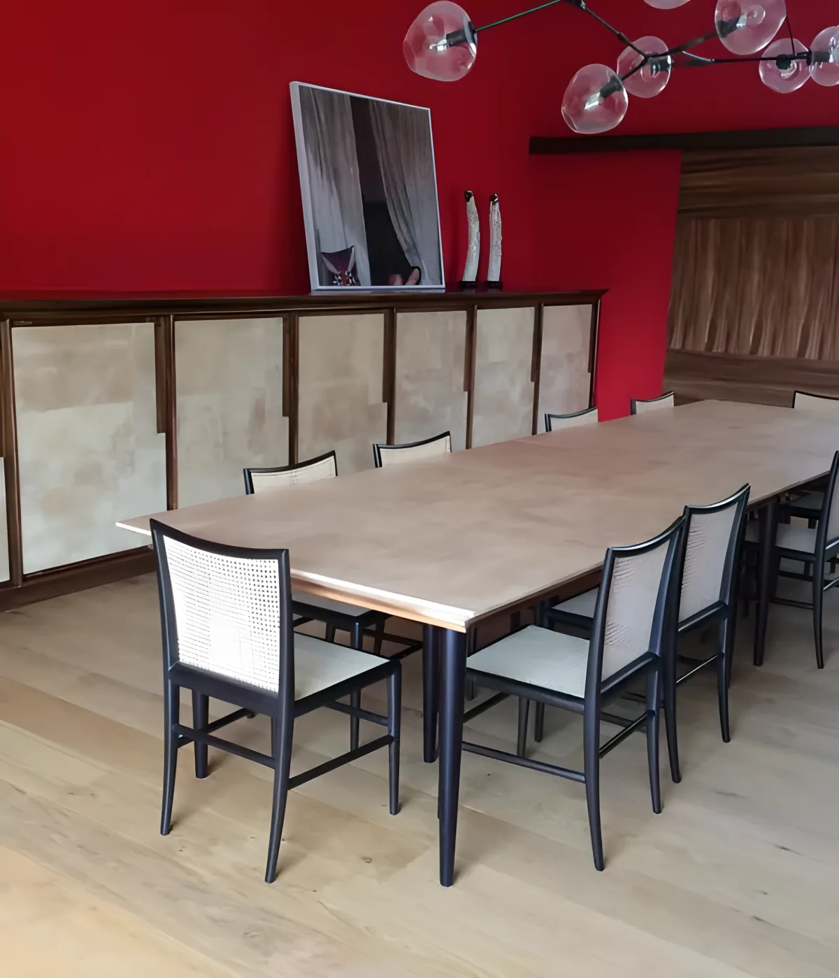 Luxury dining room with pearl parchment table credenza and cannage chairs