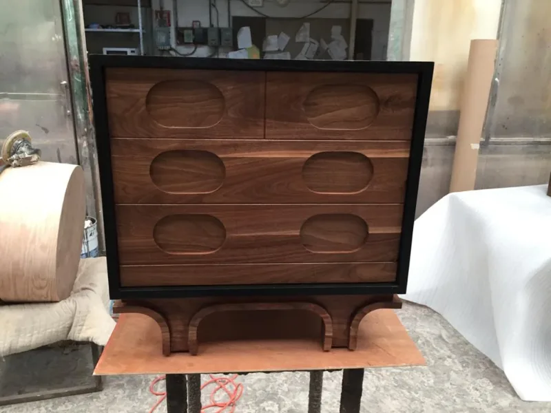 Mid-Century Modern style dresser in genuine walnut with integrated pulls and black base, fine cabinetry