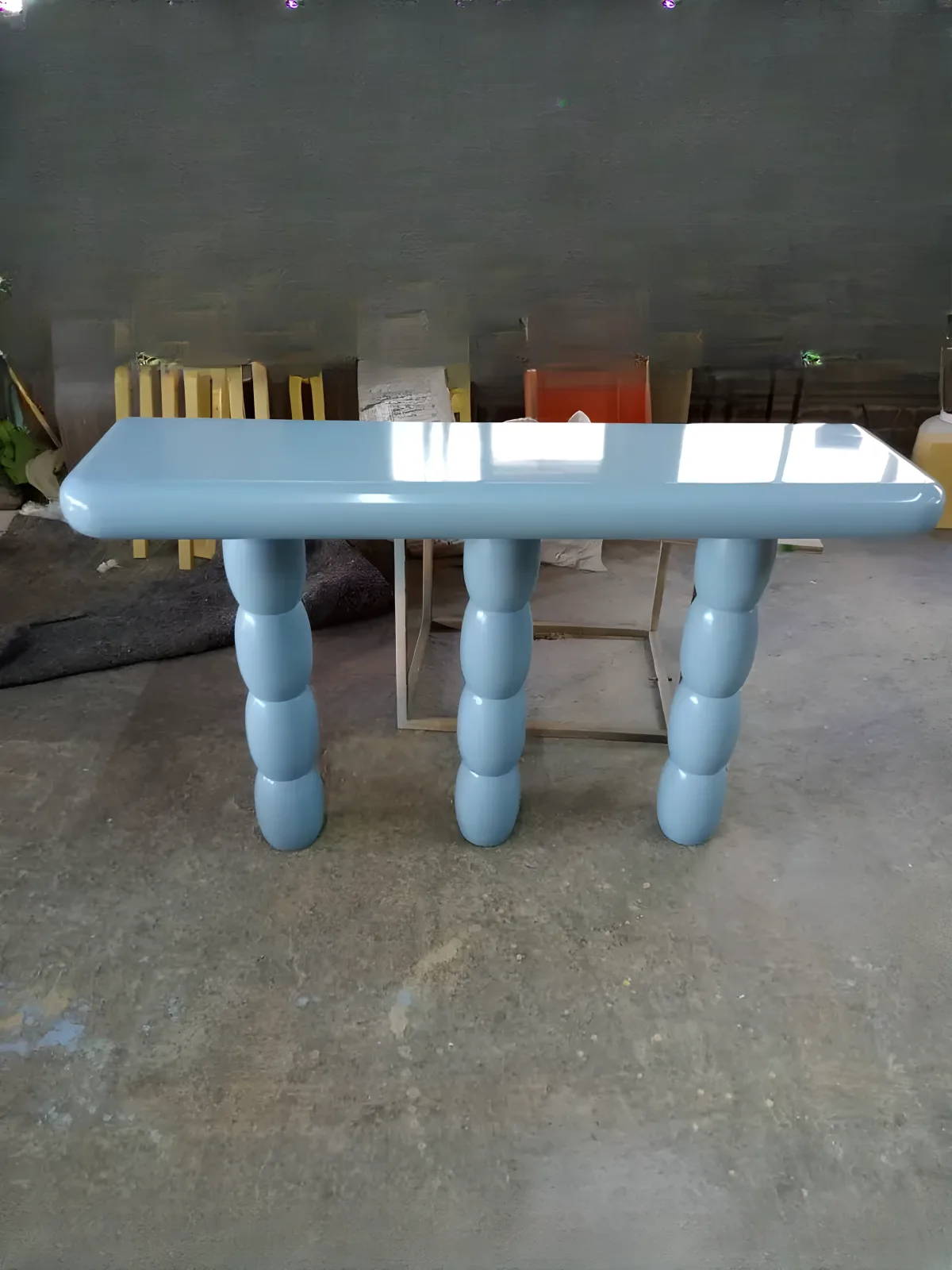 Bubbly design console in bright blue lacquer with curved shapes
