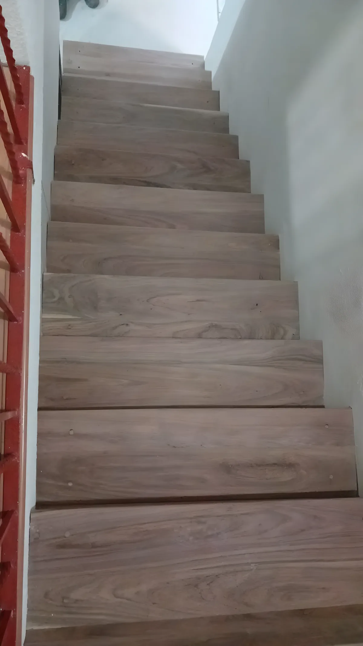 Top view of sculptural solid wood staircase, clean and modern architectural design