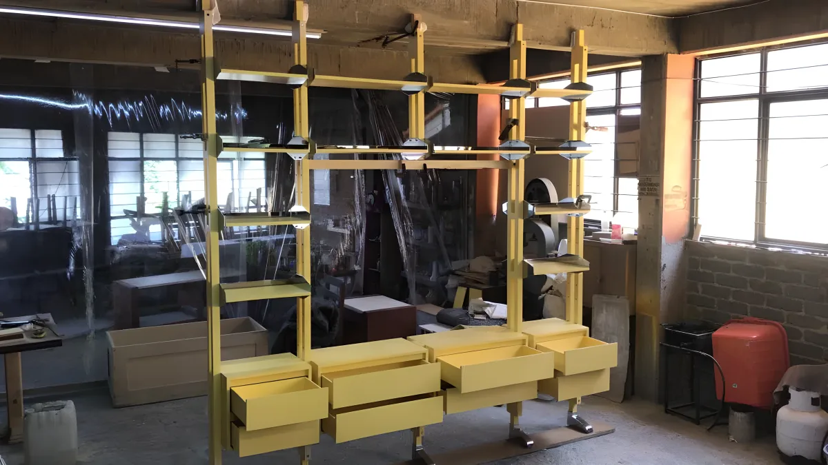 Yellow lacquered modular shelving system with drawers