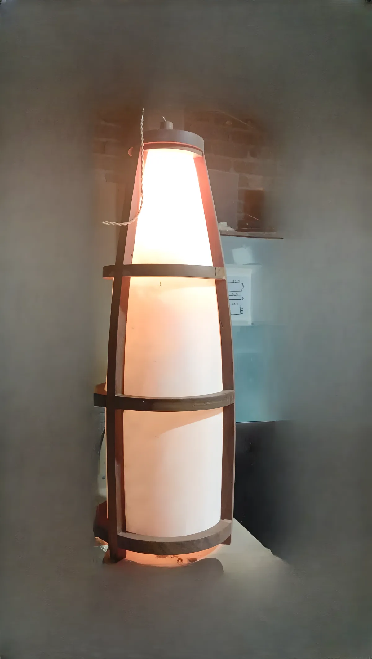 Sculptural floor lamp in wood and natural parchment