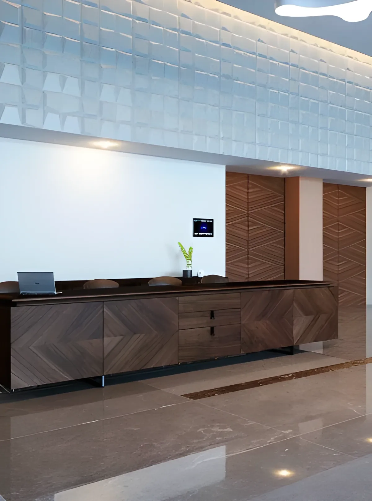 Corporate reception desk in herringbone walnut with 3D panel, luxury first impression for companies