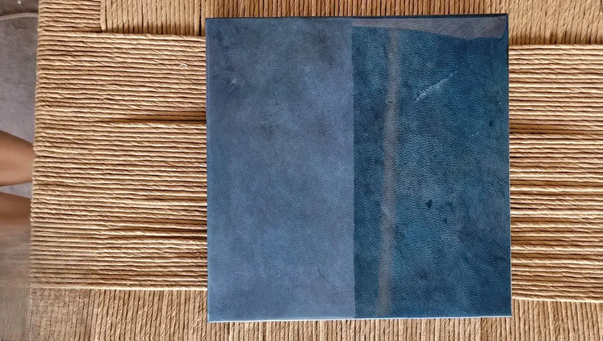 Sample of genuine parchment dyed in intense cobalt blue, skin texture for cladding